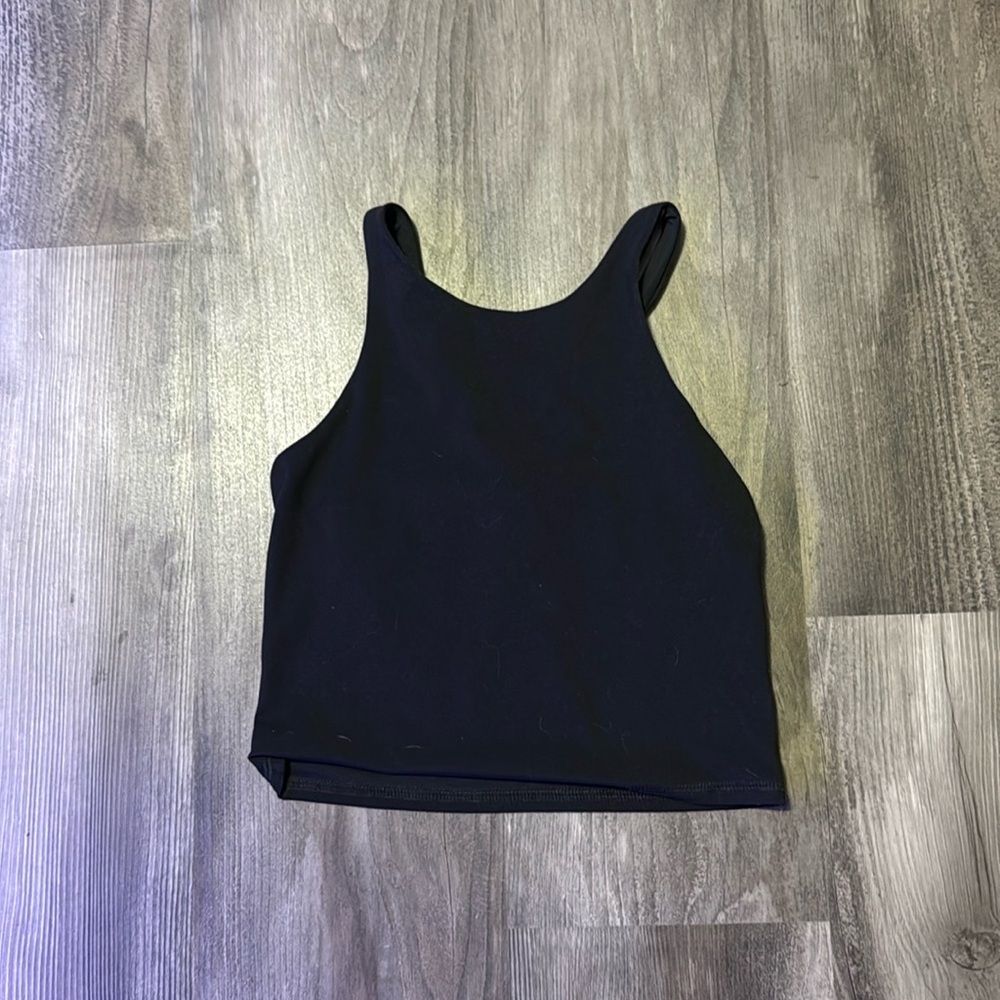 Target brand small kids tank cropped top black would fit a xs women’s.
